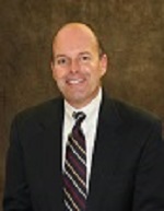 Male CEO of Perkins County Health Services, smiling