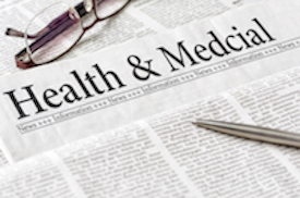 Glasses, a pen, and newspaper that says Health and Medcial at the center header